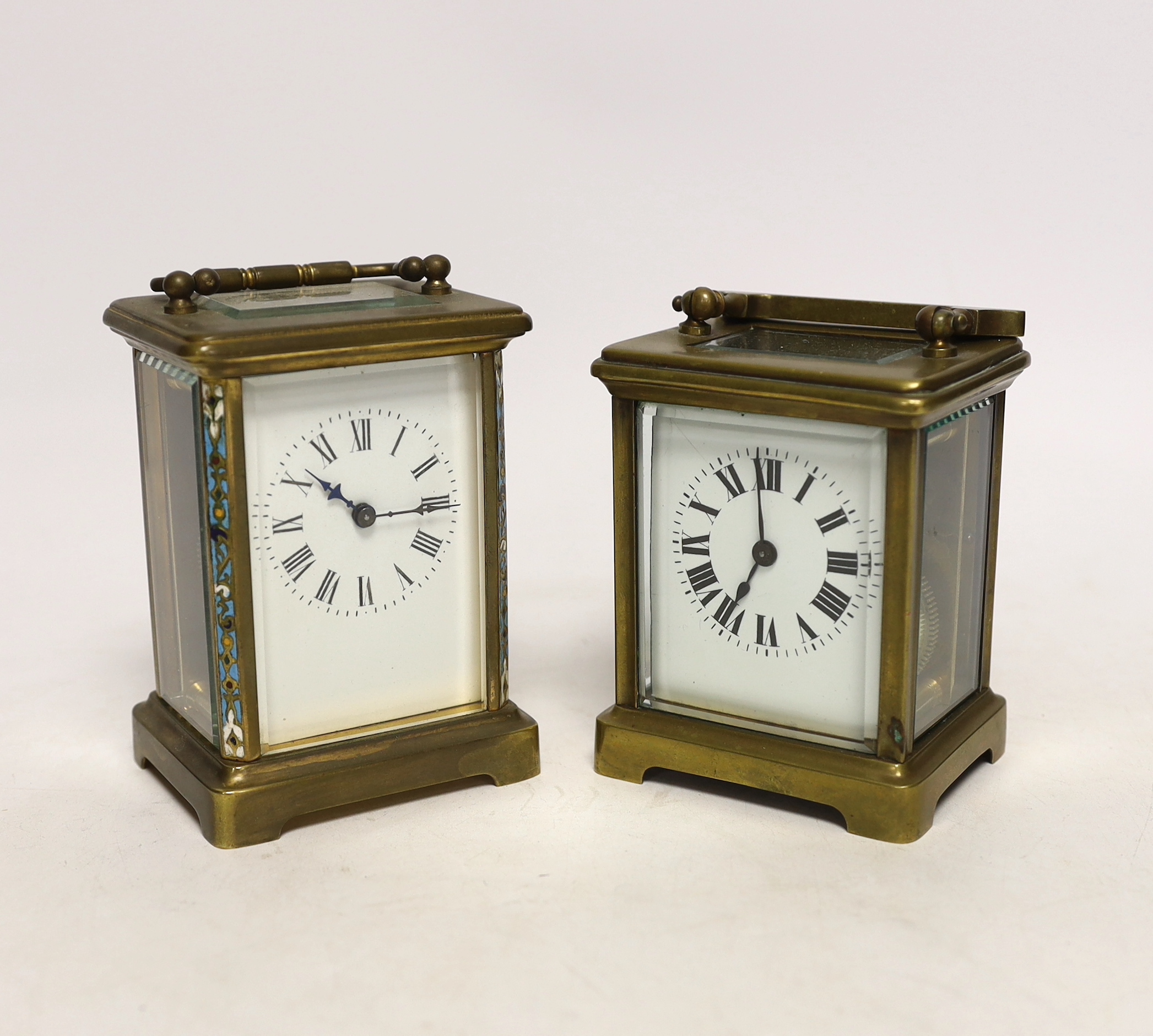 Two brass cased carriage timepieces including a French champleve enamel example with enamel dial, largest 15cm high